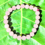 Rose Quartz Bracelet Resting on Sacred Fig Leaf